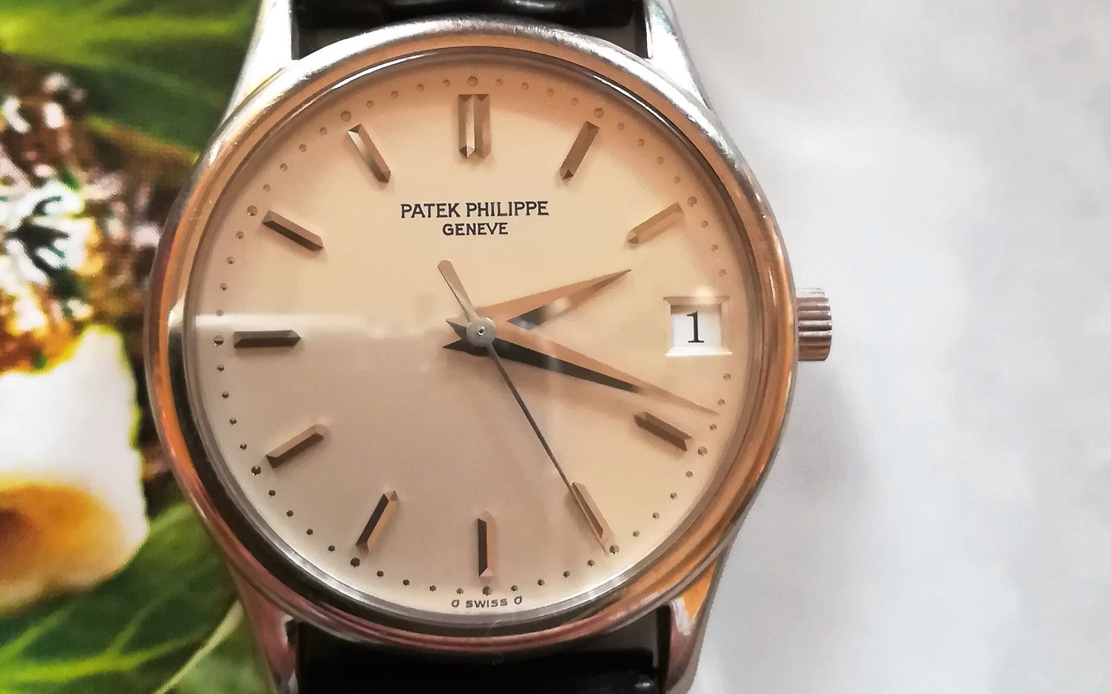 Patek Philippe Calatrava minimalist luxury dress watch in precious metal with clean white dial and alligator strap